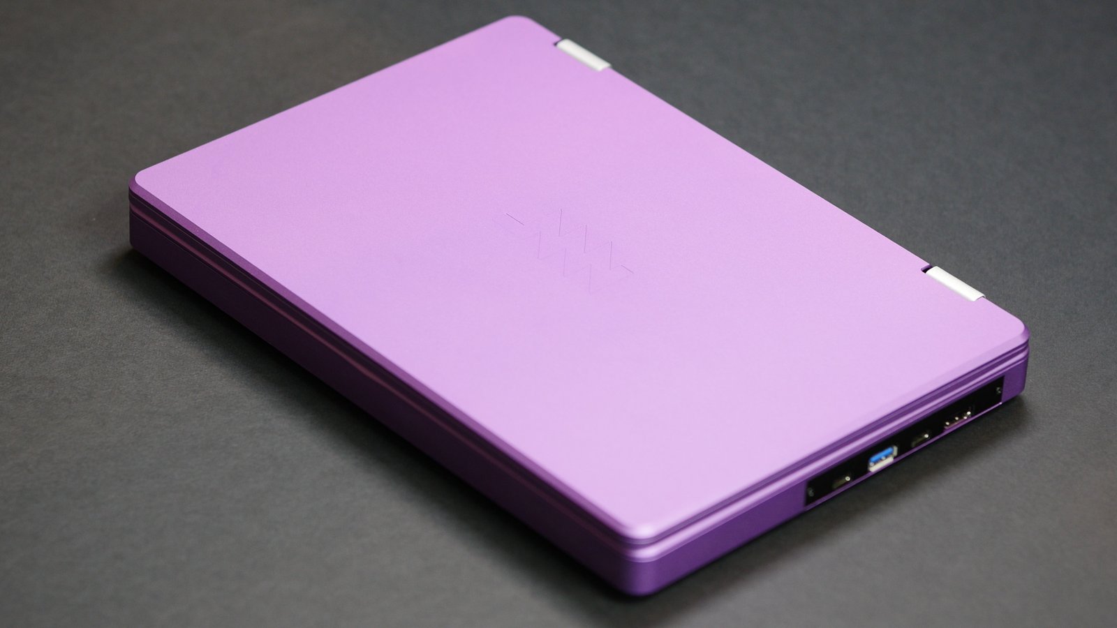 A purple anodized Reform Next with the lid closed, and you can see the MNT logo on the display housing.